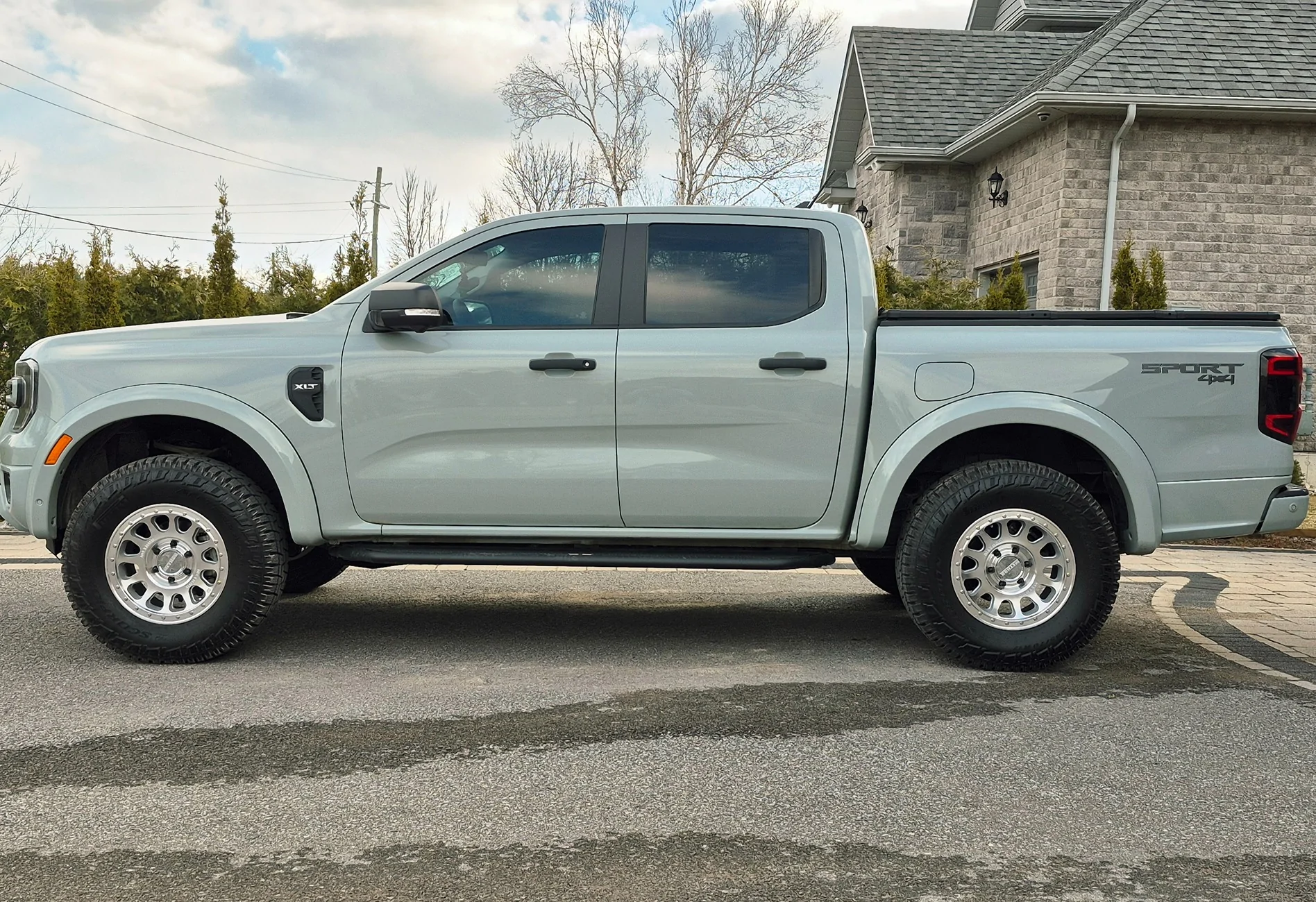 Light gray pickup truck parked in driveway